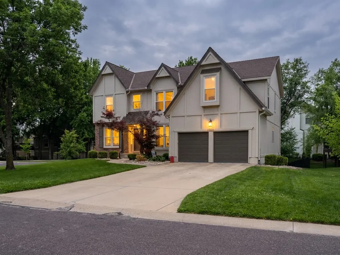 Two-story tudor front exterior at twilight — AI-enhanced sample