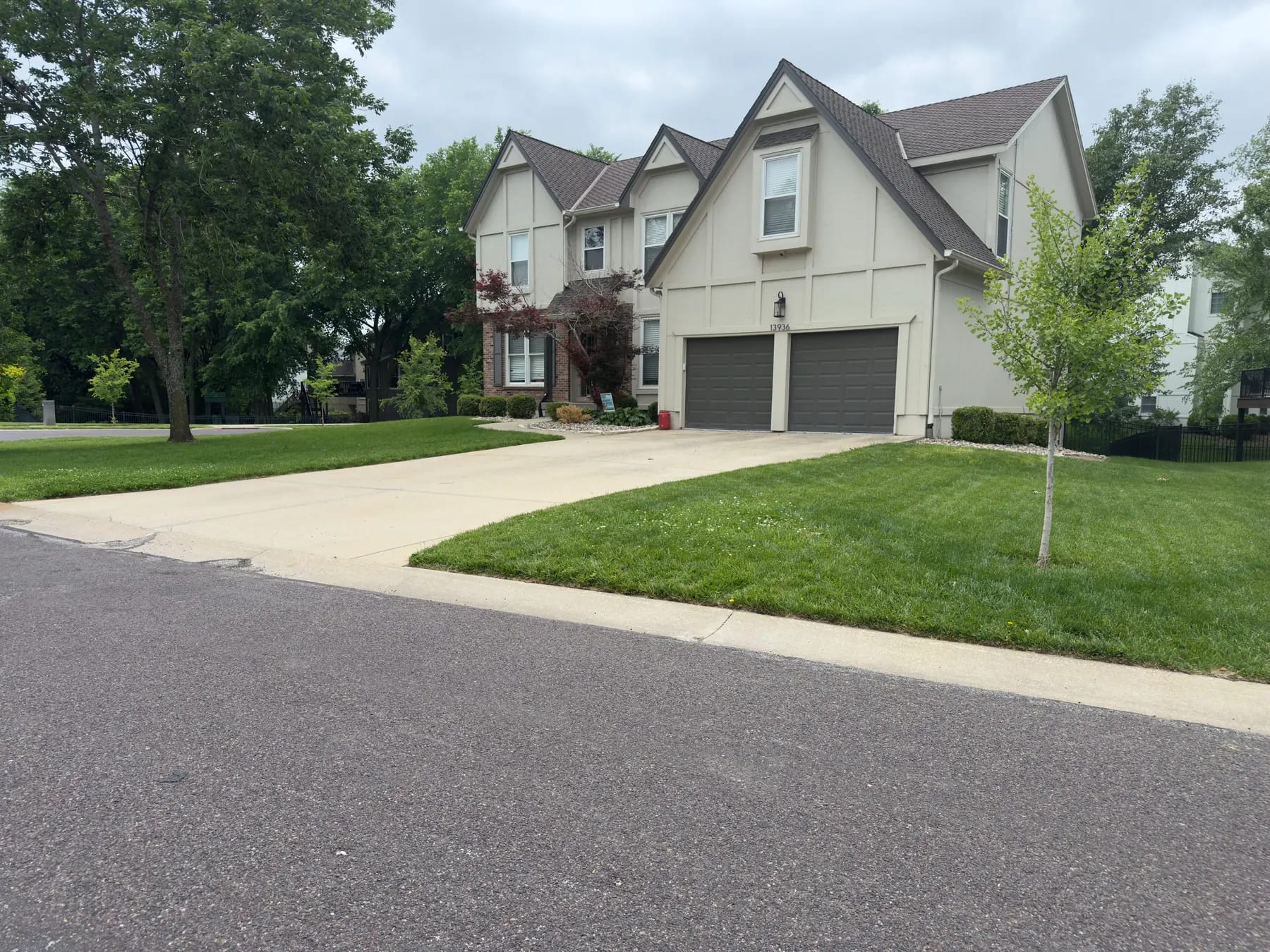 Two-story tudor front exterior — before