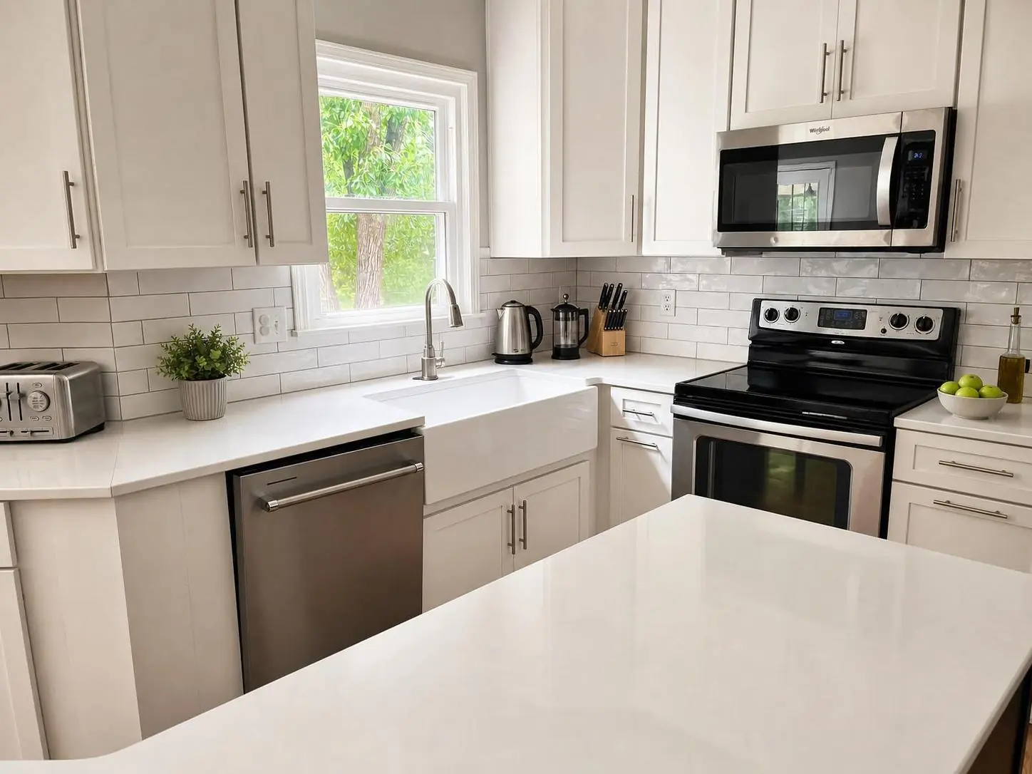 Kitchen with farmhouse sink and subway-tile backsplash — after